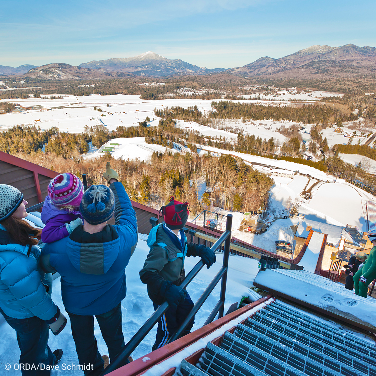 Family looking over lake placid