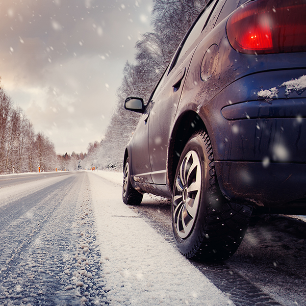 car driving on snowy road 