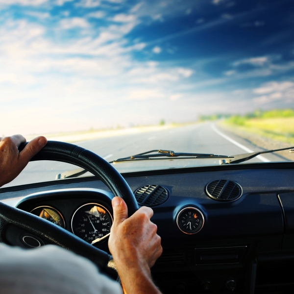 view from rear seat driver on open road