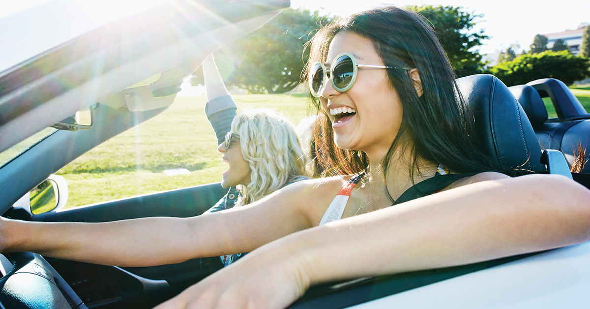 happy driver in rental car