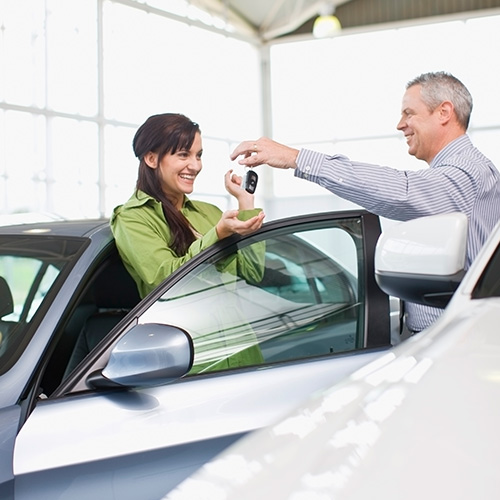 Woman in Car Dealership